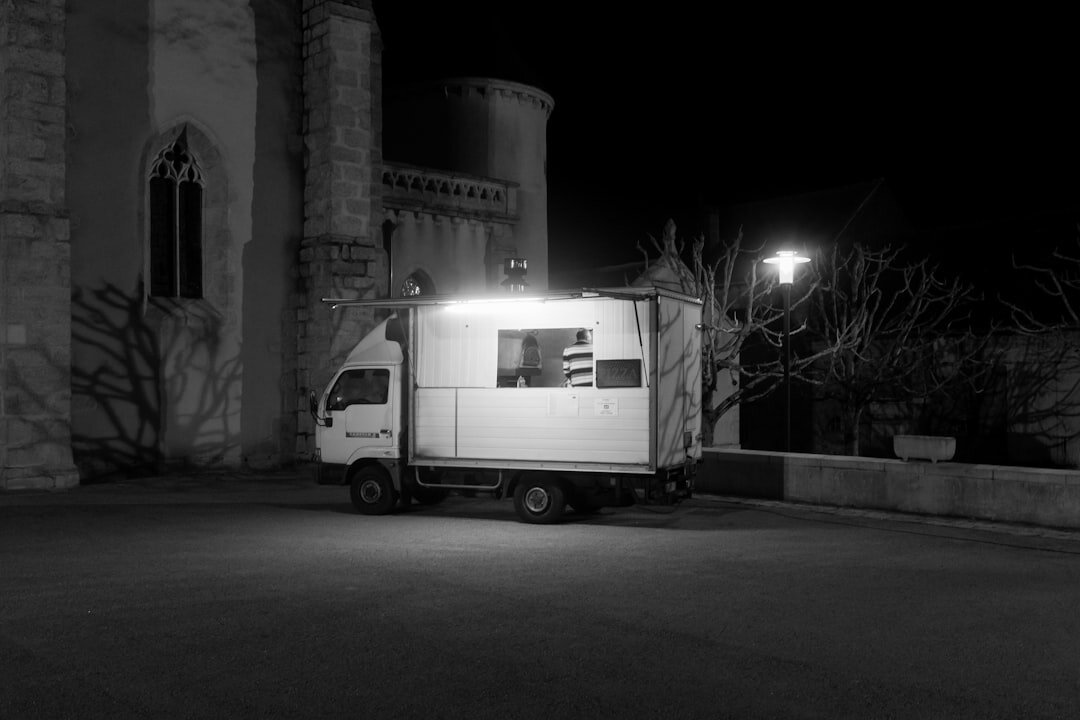 Outside broadcast van with satellite dish preparing for a live report